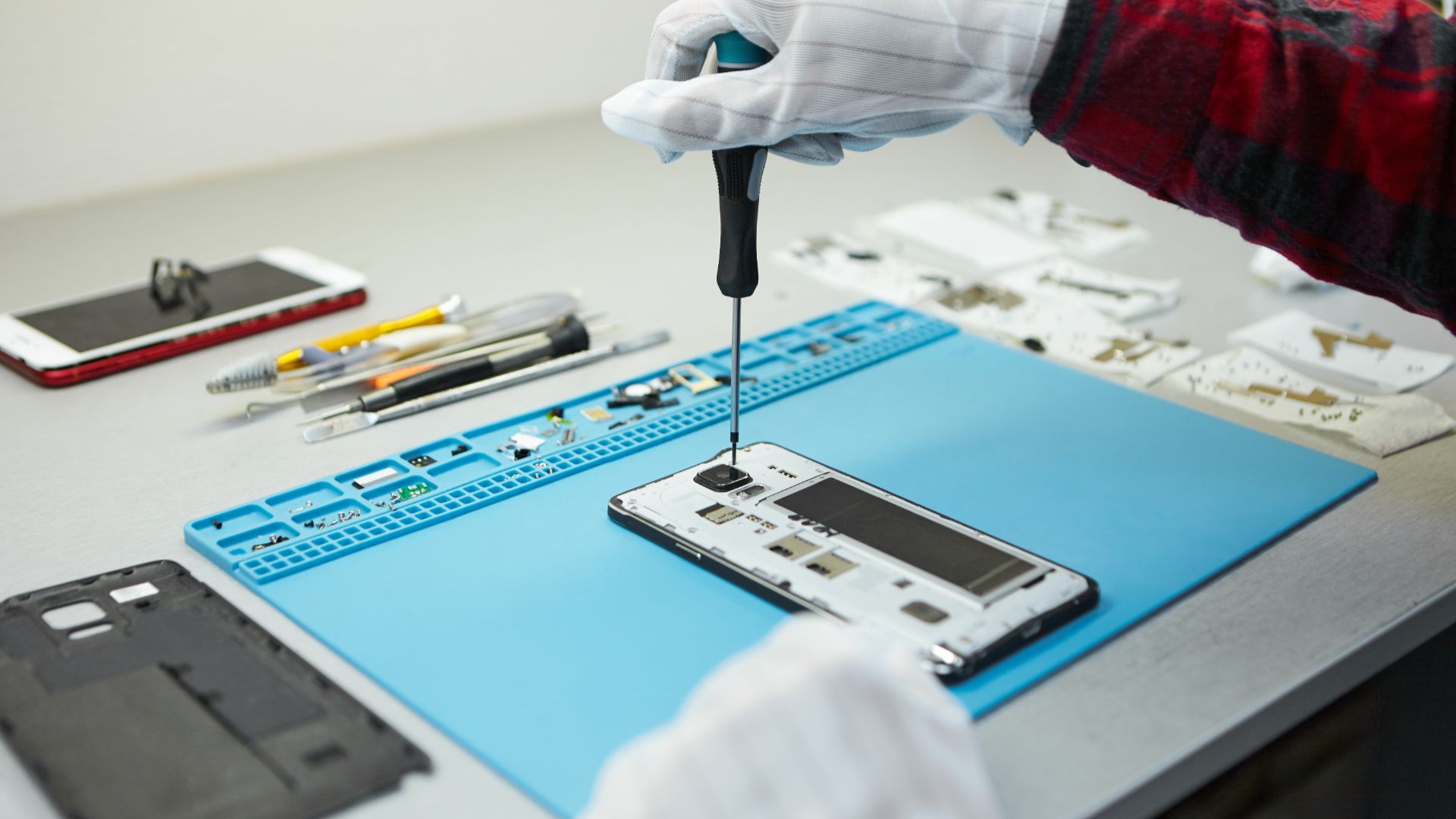 Technician repairing a phone